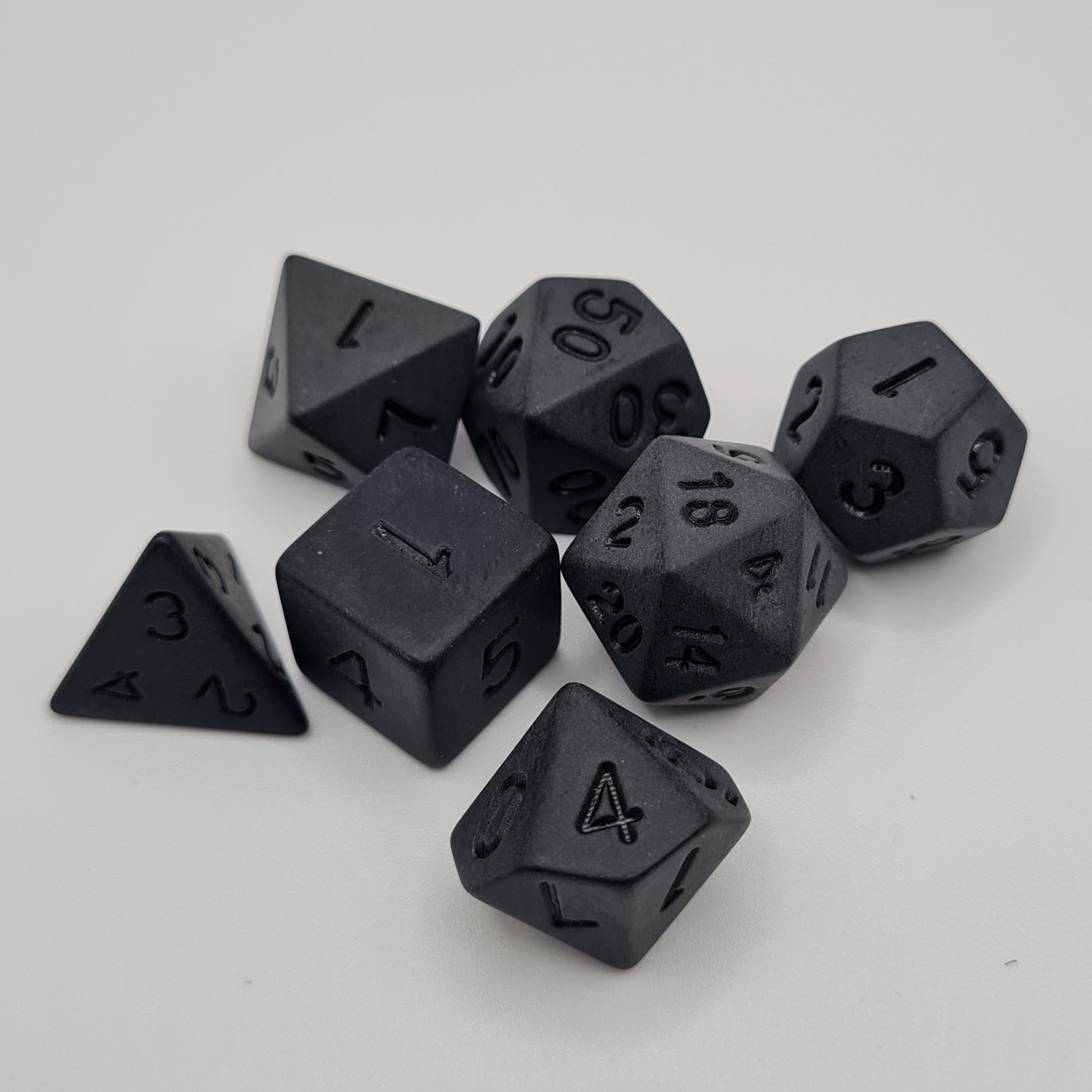 Black Polyhedral Dice Set – 7-Piece Tabletop Gaming Dice with Bag
