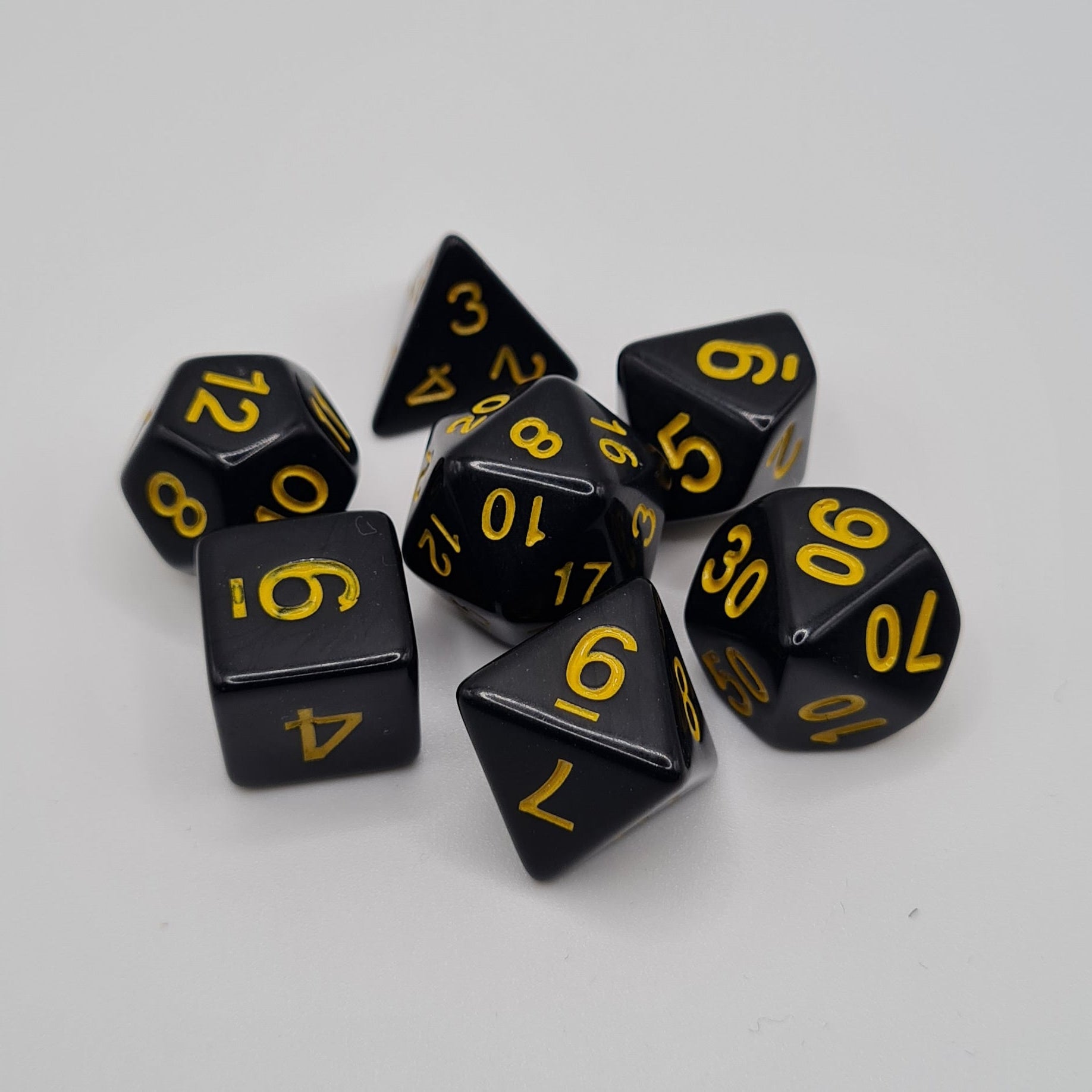 Black with Yellow Numbers Polyhedral Dice Set – 7-Piece Tabletop Gaming Dice with Bag