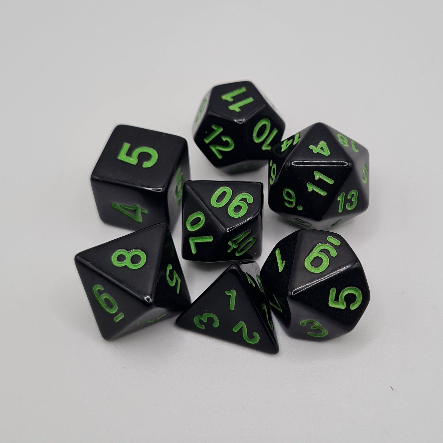 Black with Green Numbers Polyhedral Dice Set – 7-Piece Tabletop Gaming Dice with Bag