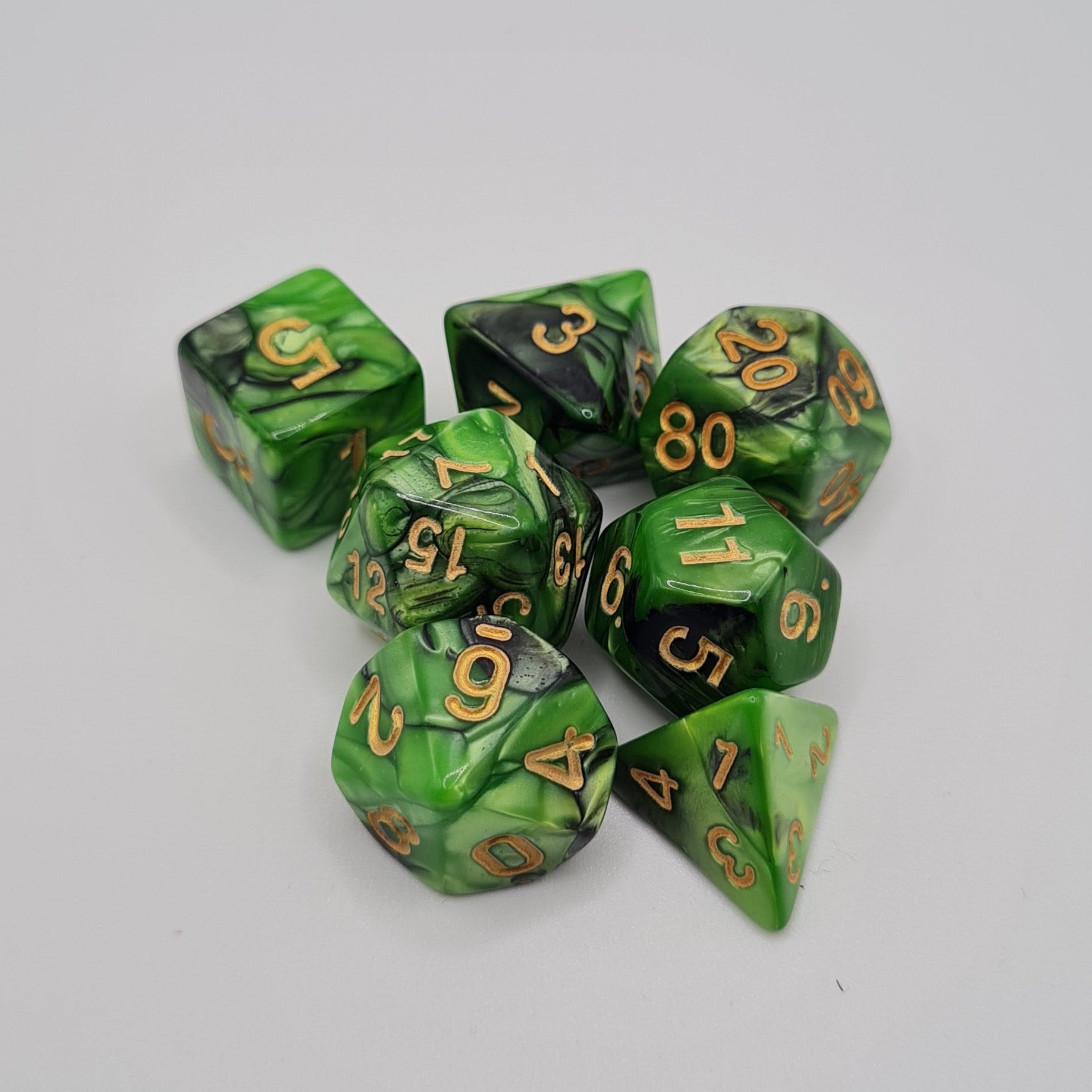 Green and Black Swirls Polyhedral Dice Set – 7-Piece Tabletop Gaming Dice with Bag