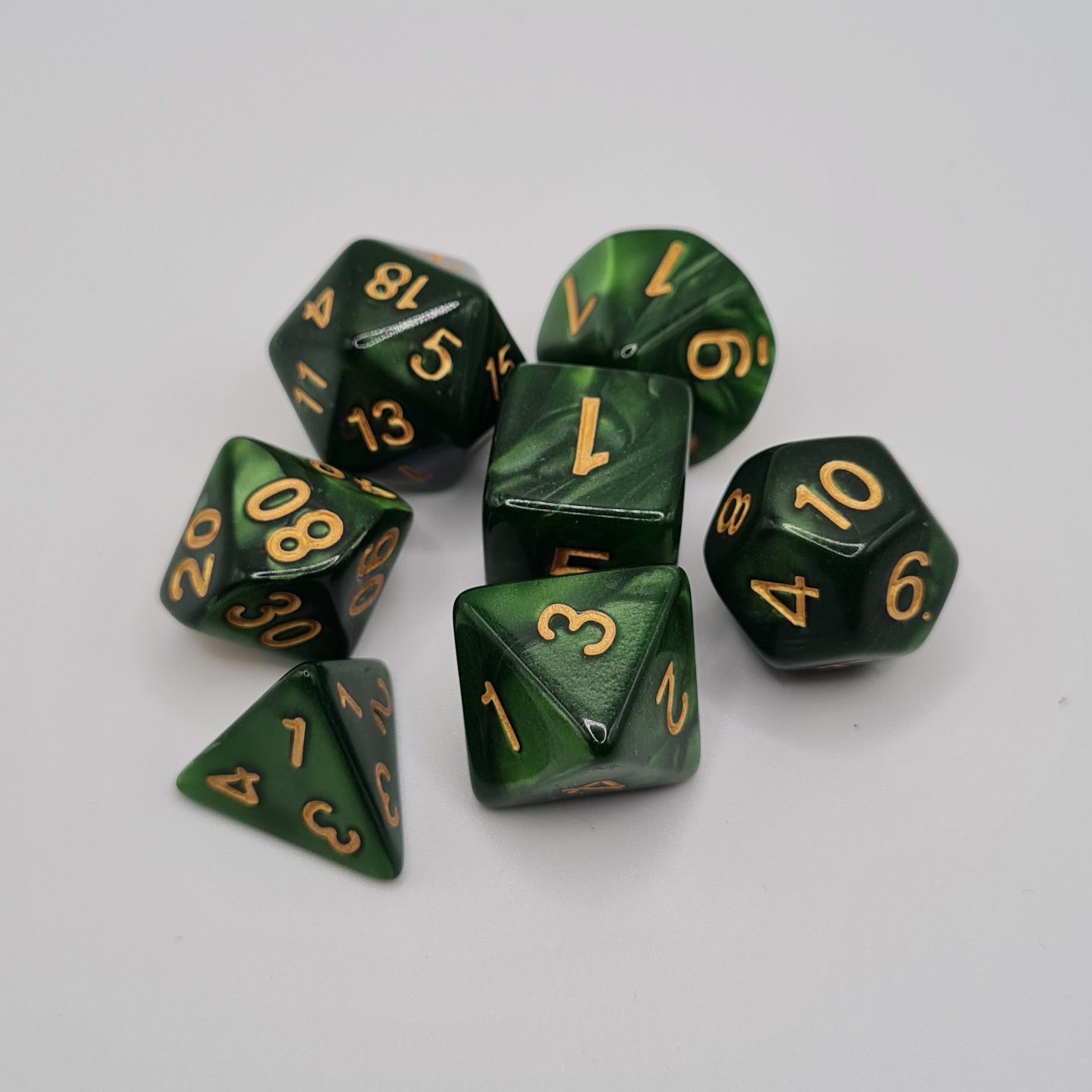 Green and Black Swirls Polyhedral Dice Set – 7-Piece Tabletop Gaming Dice with Bag