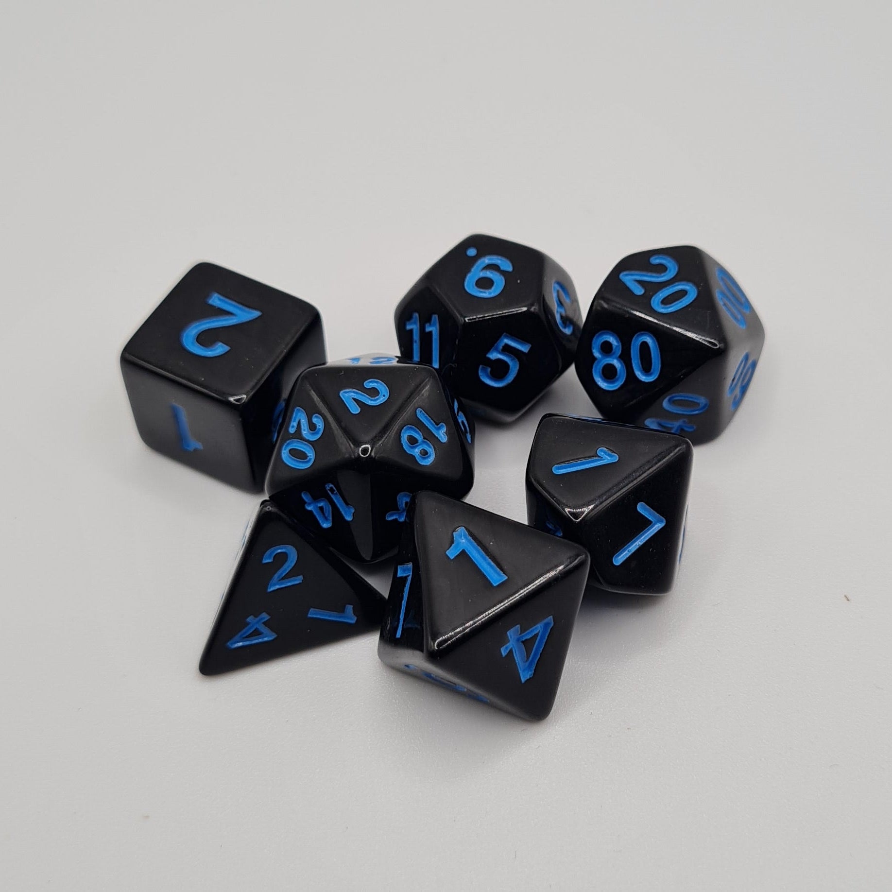 Black with Blue Numbers Polyhedral Dice Set – 7-Piece Tabletop Gaming Dice with Bag
