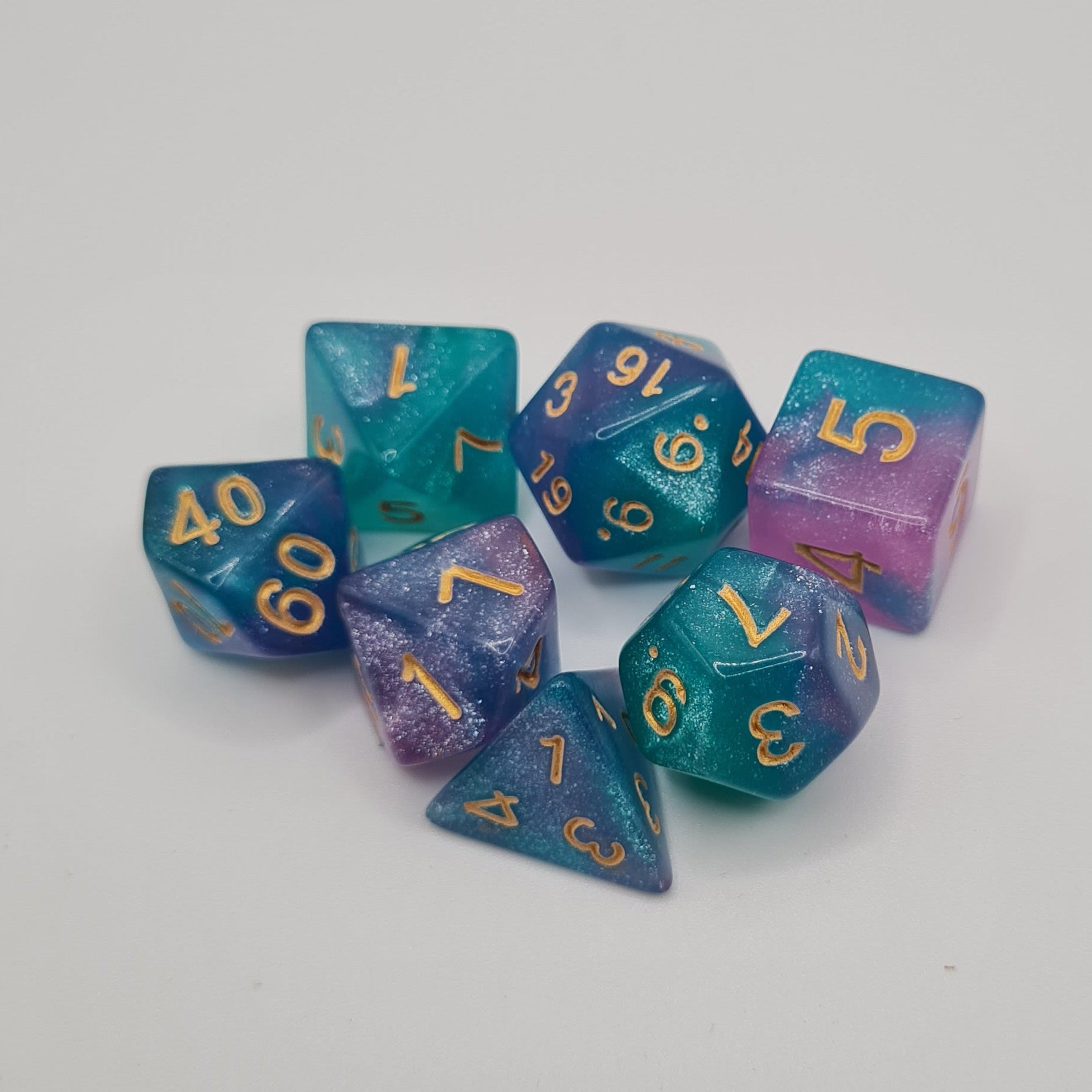 Teal and Pink Polyhedral Dice Set – 7-Piece Tabletop Gaming Dice with Bag