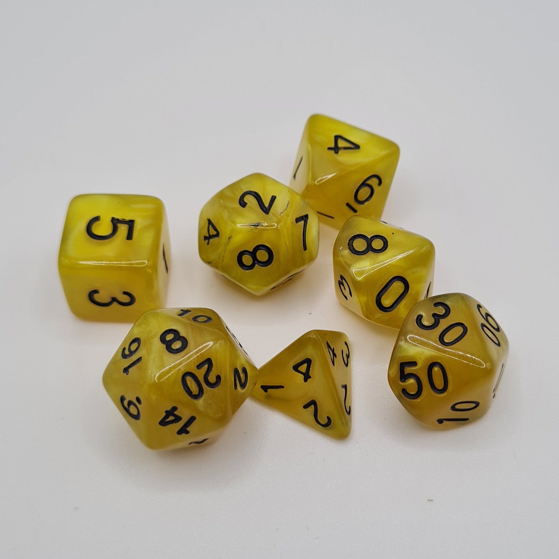 Yellow Swirl Black Numbers Polyhedral Dice Set – 7-Piece Tabletop Gaming Dice with Bag