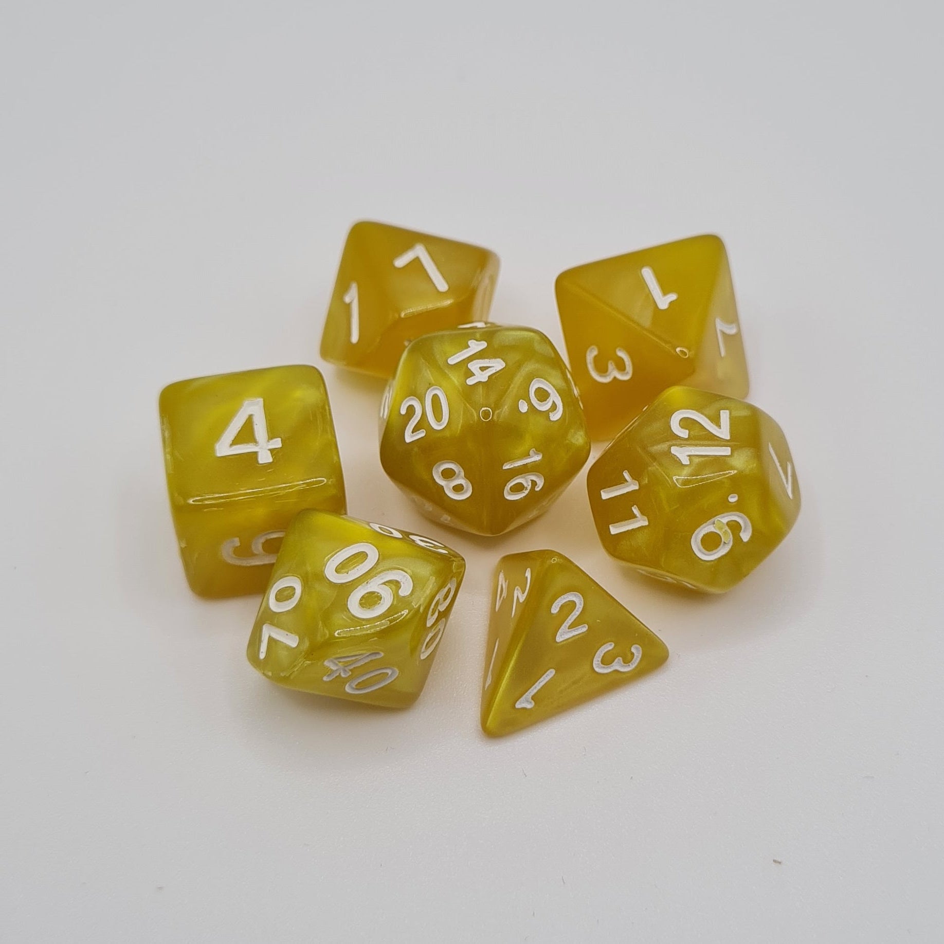 Yellow Swirls Polyhedral Dice Set – 7-Piece Tabletop Gaming Dice with Bag
