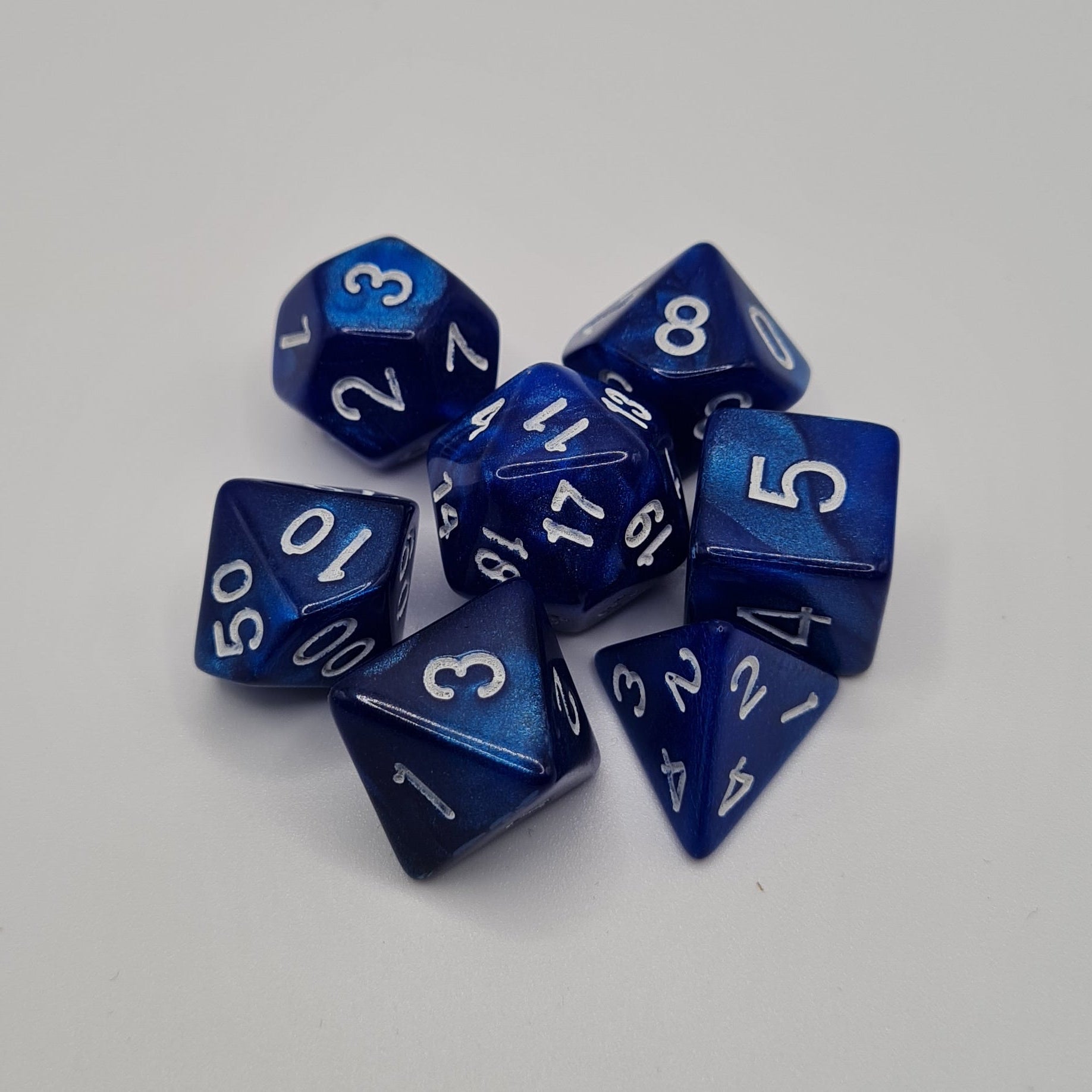 Blue Swirls White Numbers Polyhedral Dice Set – 7-Piece Tabletop Gaming Dice with Bag