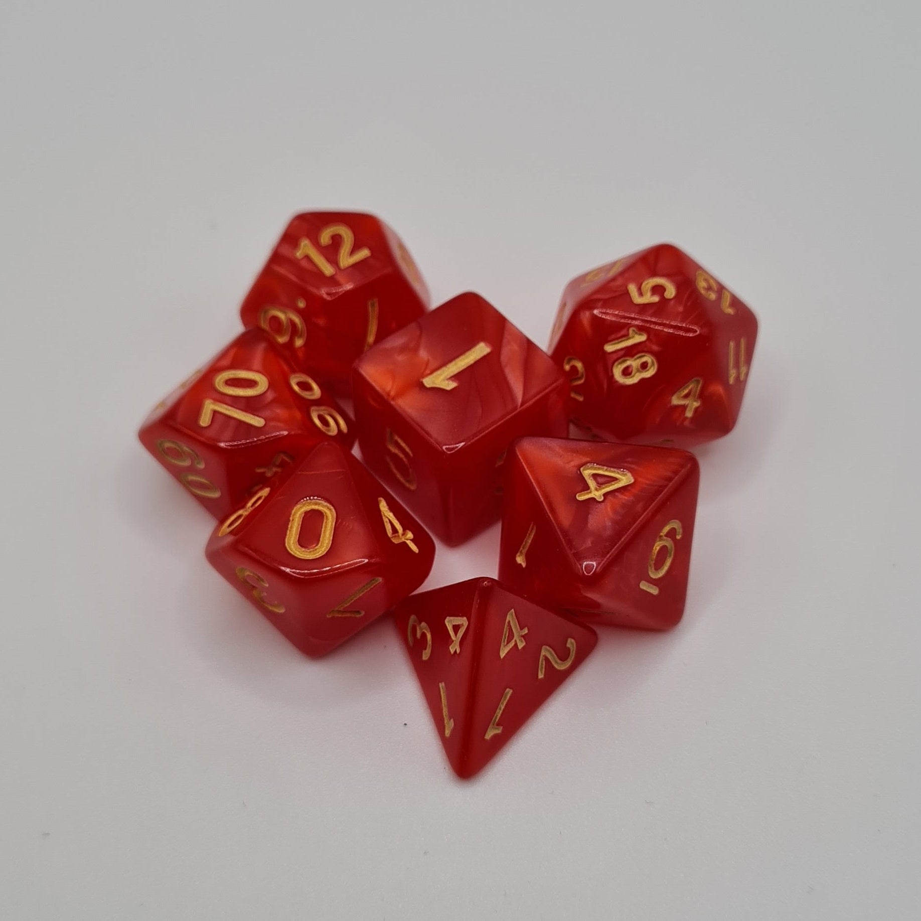 Red Swirl Polyhedral Dice Set – 7-Piece Tabletop Gaming Dice with Bag