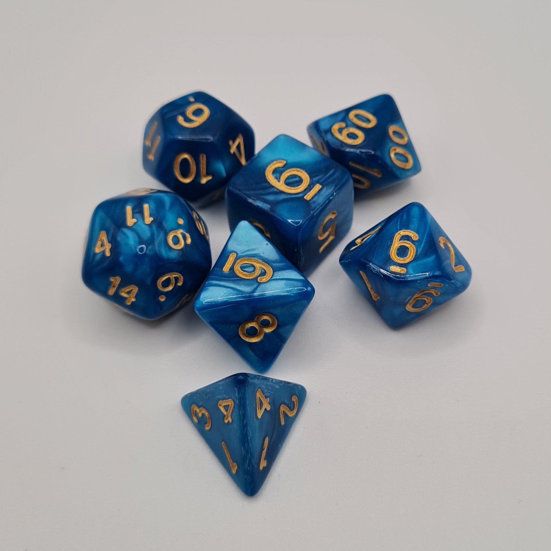 Blue Swirls Gold Numbers Polyhedral Dice Set – 7-Piece Tabletop Gaming Dice with Bag