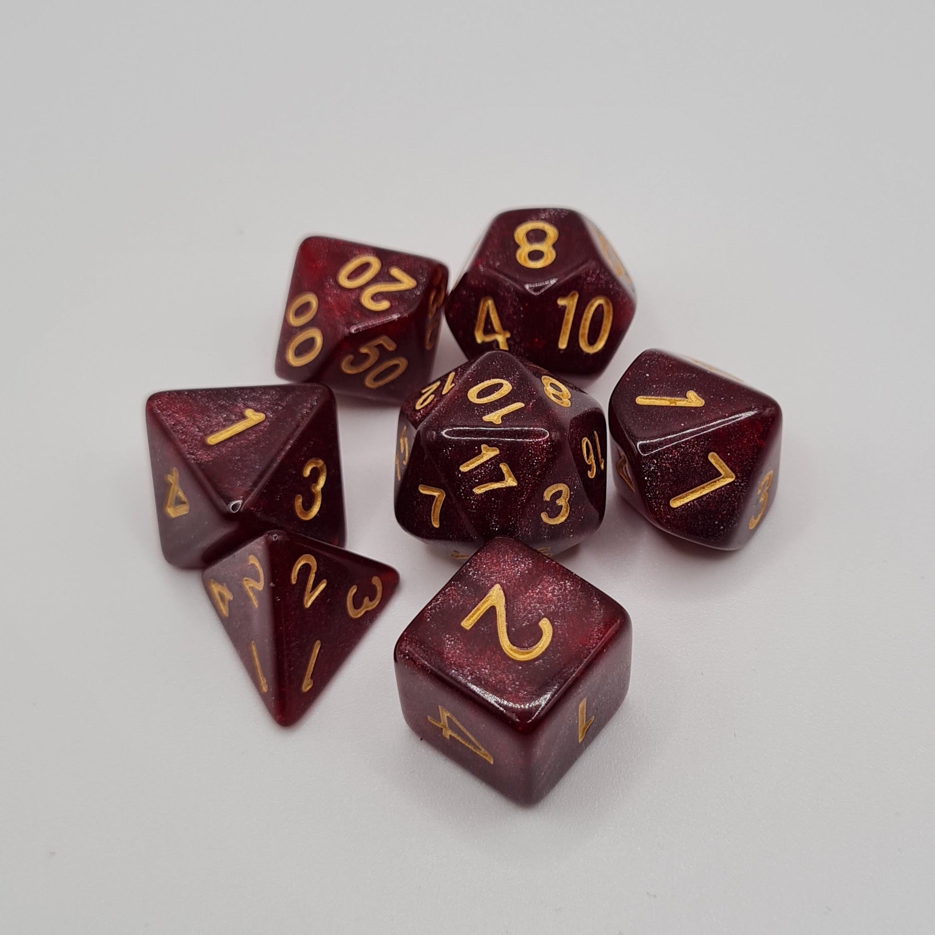 Wine Glitter Gold Numbers Polyhedral Dice Set – 7-Piece Tabletop Gaming Dice with Bag