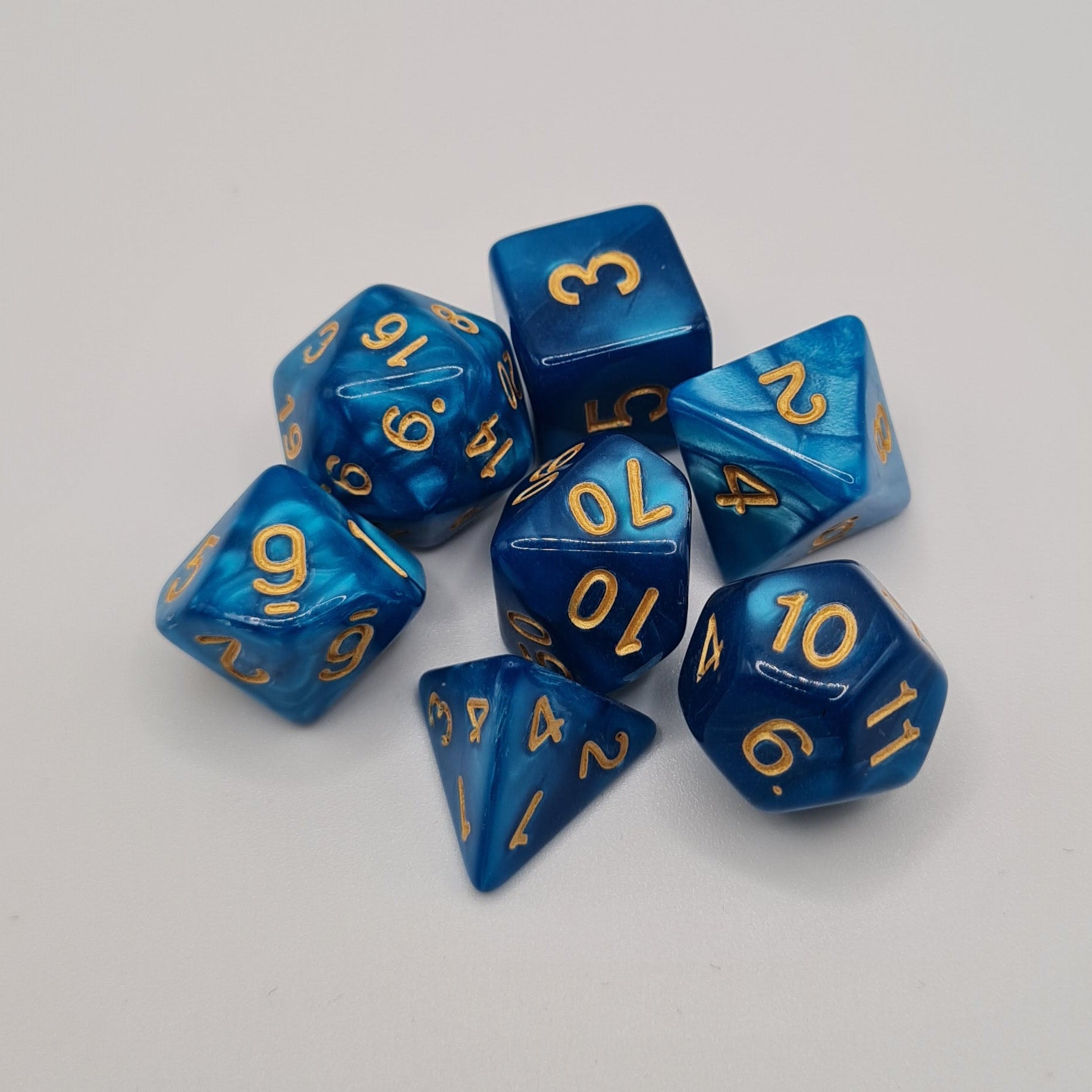 Blue Swirls Gold Numbers Polyhedral Dice Set – 7-Piece Tabletop Gaming Dice with Bag