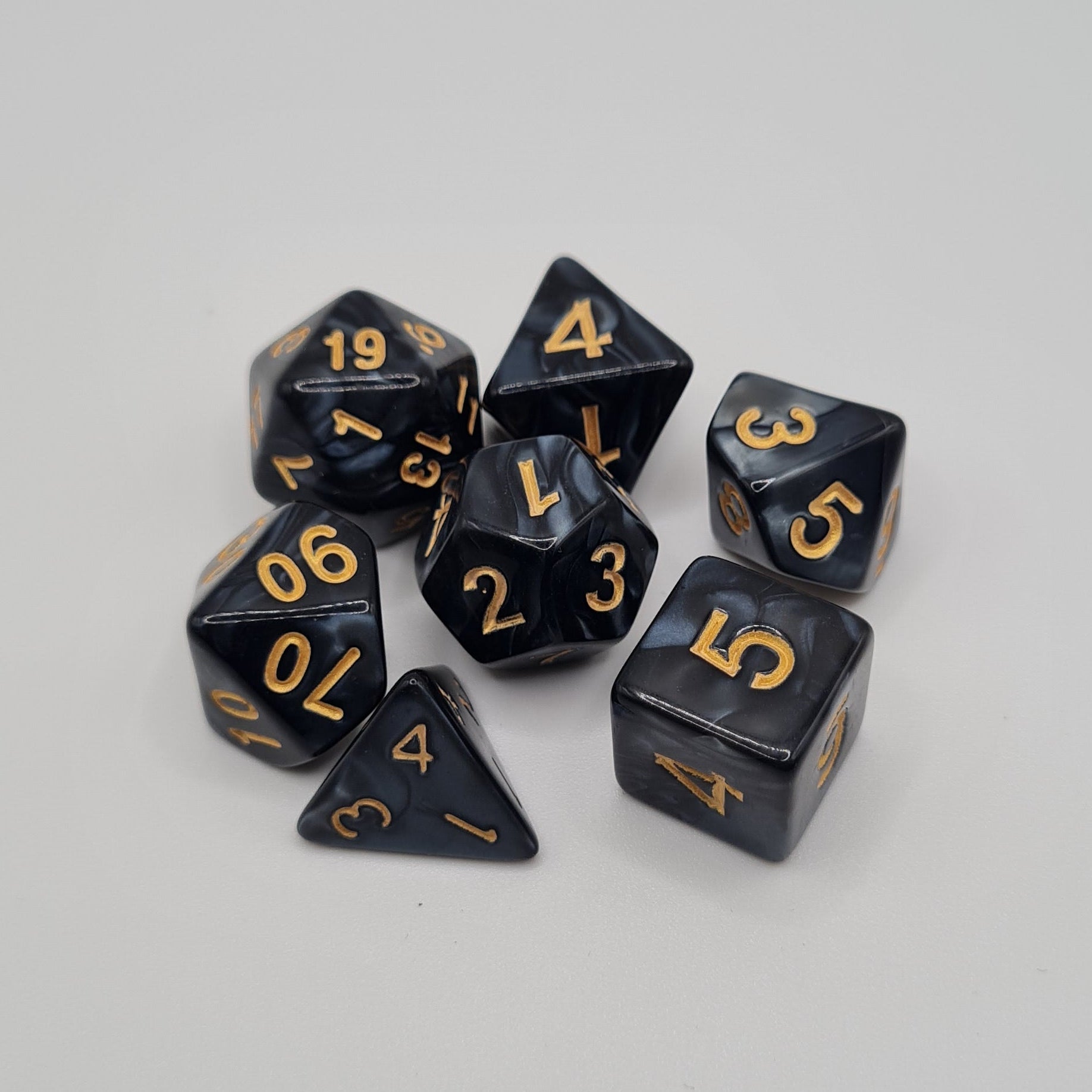 Black Swirls Gold Numbers Polyhedral Dice Set – 7-Piece Tabletop Gaming Dice with Bag