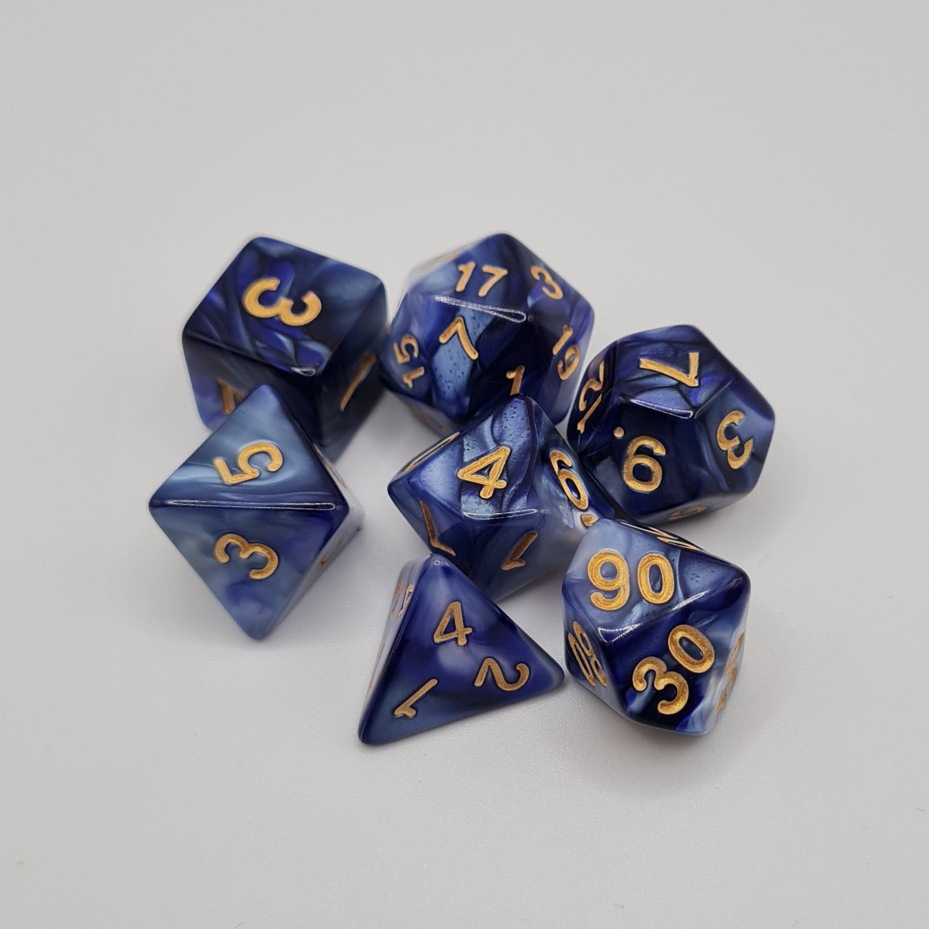 Blue Swirl Gold Numbers Polyhedral Dice Set – 7-Piece Tabletop Gaming Dice with Bag