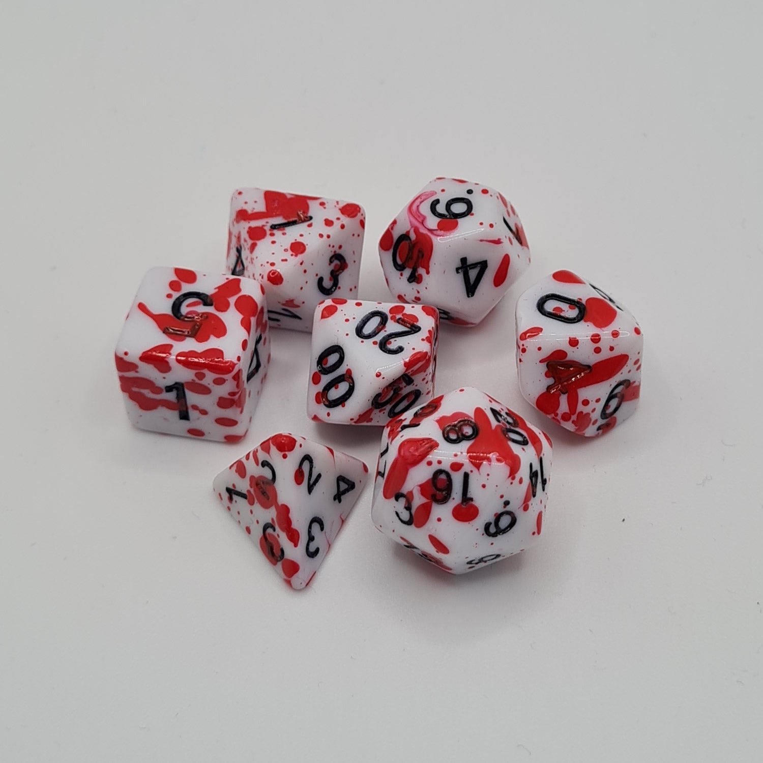 Red Speckled Polyhedral Dice Set – 7-Piece Tabletop Gaming Dice with Bag